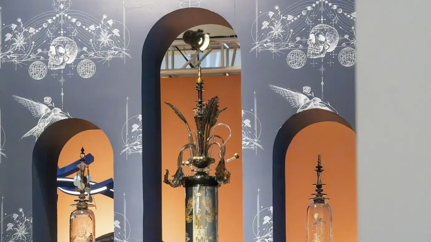 Painted archways framing a gallery display