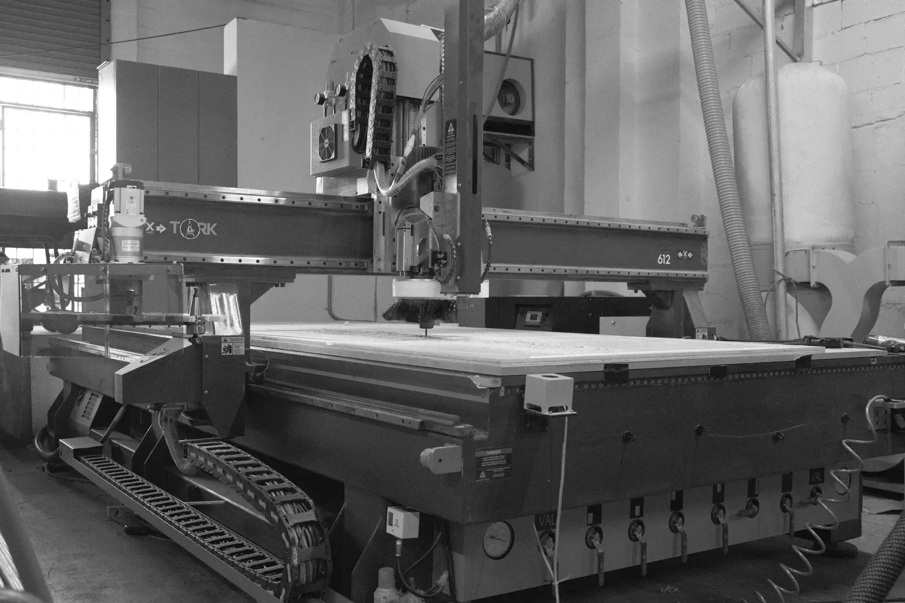 Tork CNC router with a sheet loaded on the bed, APSOGI shop floor, Miami