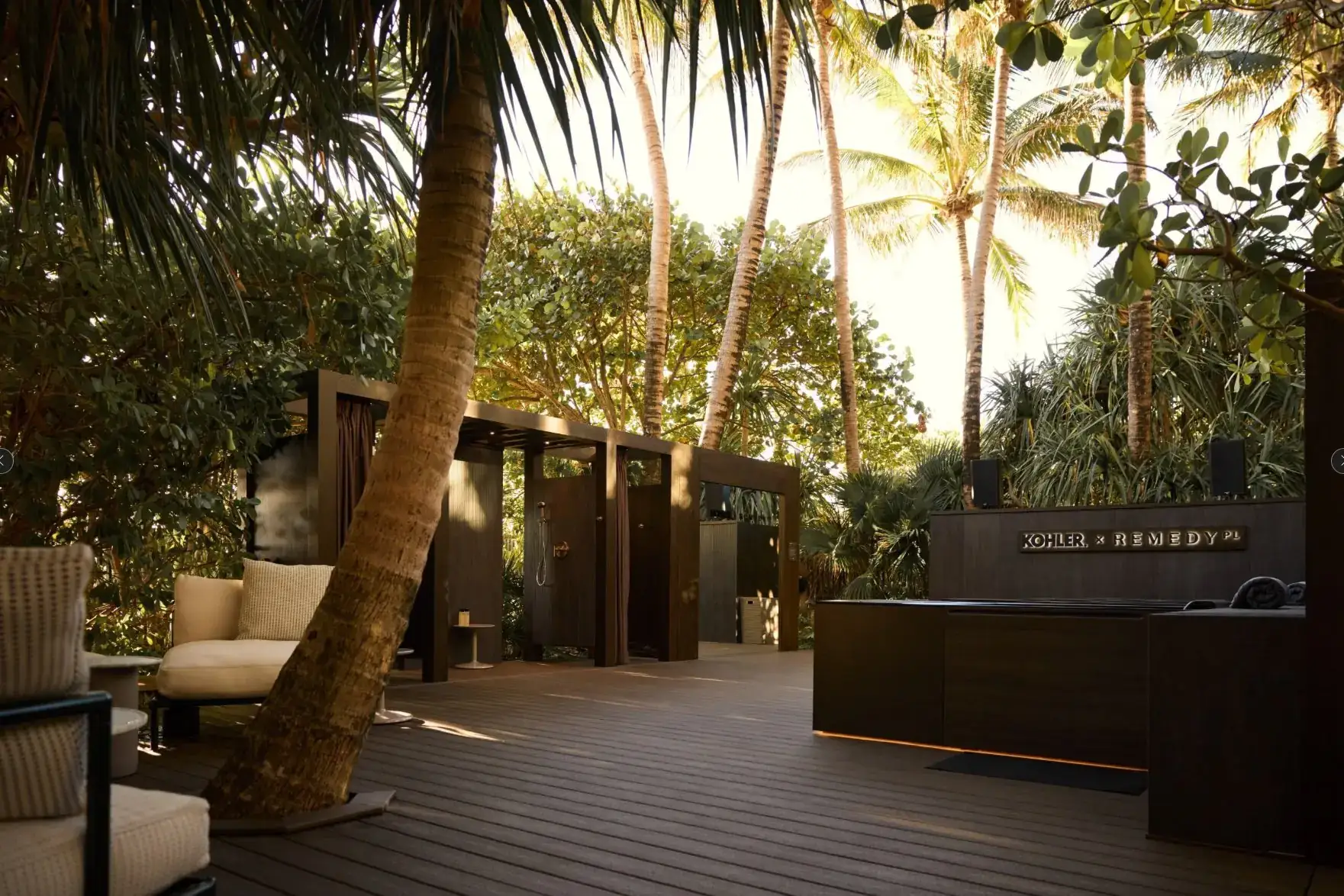 Kohler x Remedy cold-plunge activation with wood decking and enclosures under palms