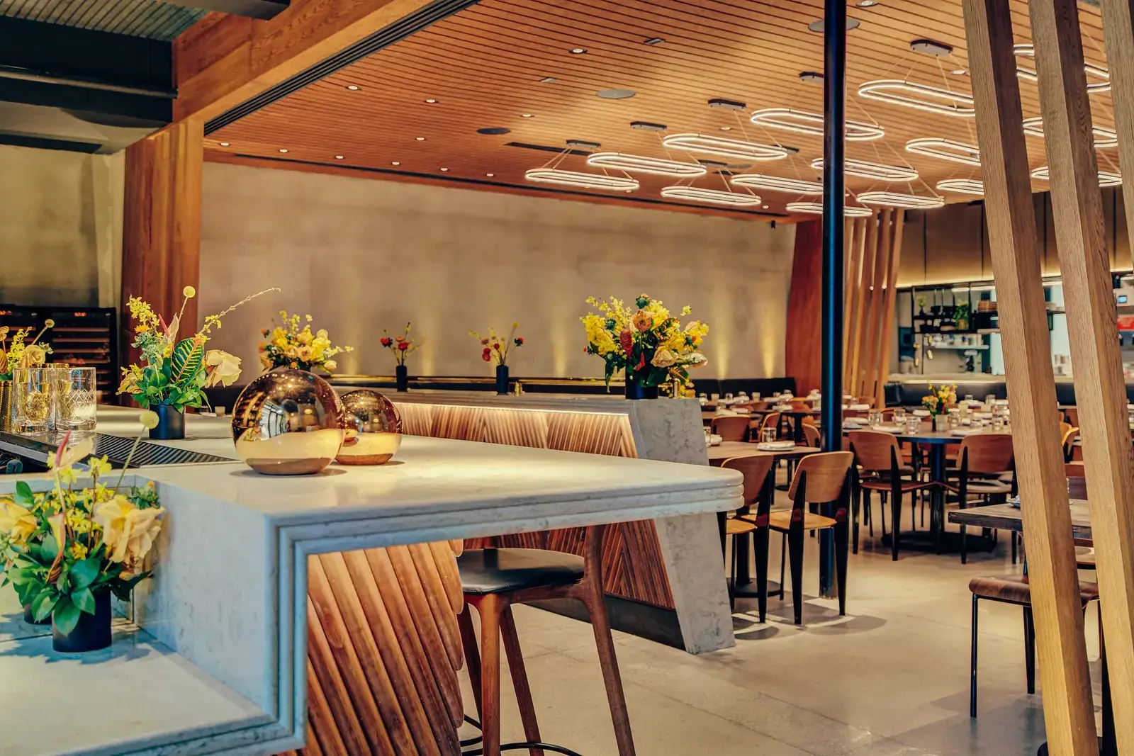 As built: KYU Restaurant, Wynwood. Marble bar, tambour face, back-bar shelving. Designer: Mark Alan Diaz.